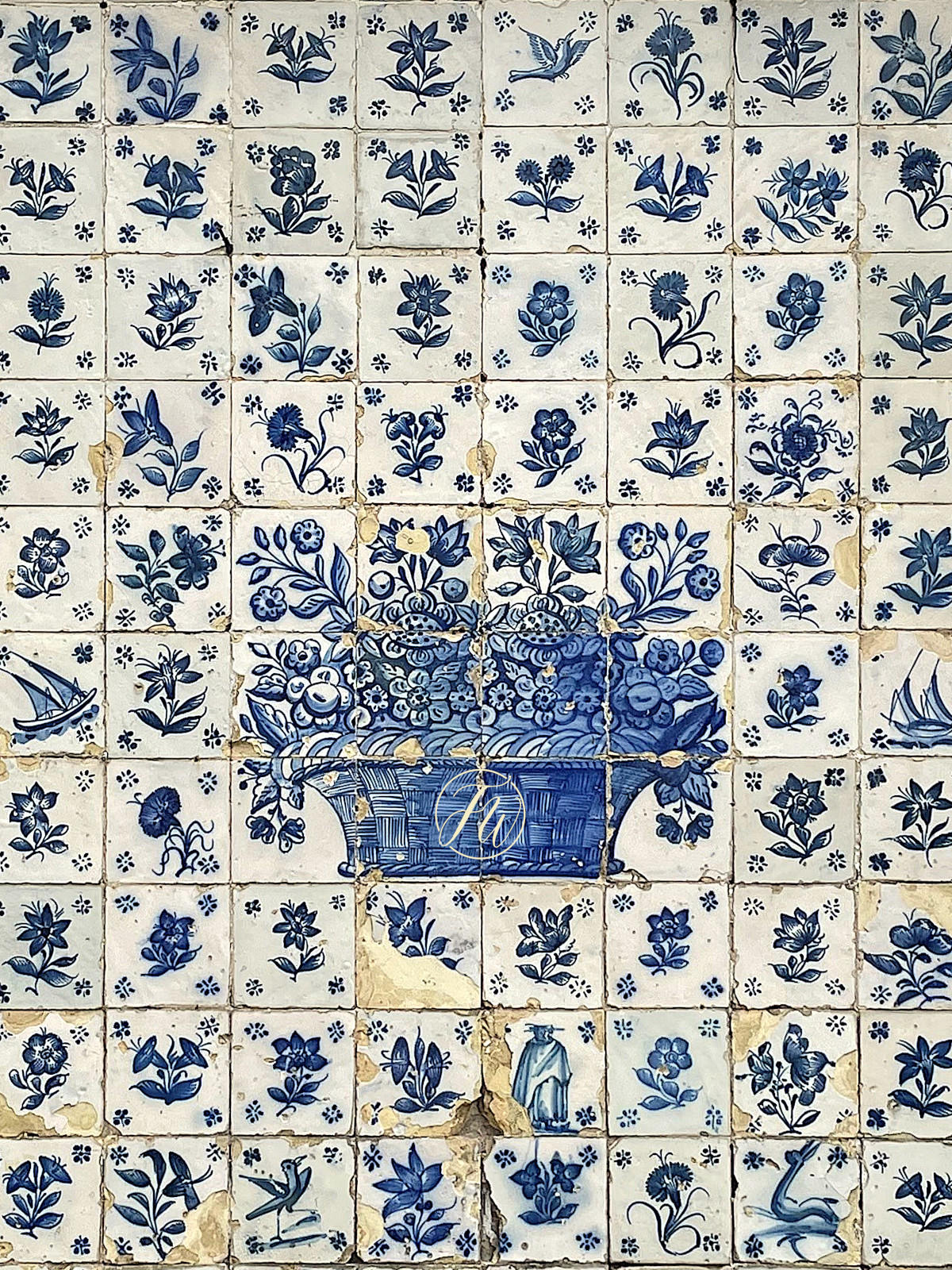 Decorative tiles with blue floral and basket design on a white background